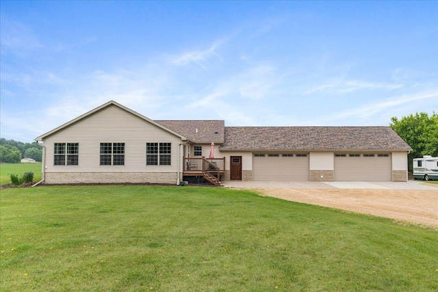 E633 950th Ave, Stanton Twp, WI 54734 - view of front of property featuring driveway, a front yard, a garage, and brick siding