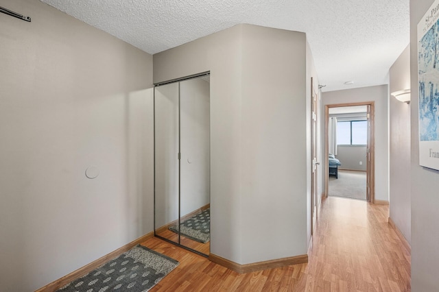 78 10th St E Unit 2901, Saint Paul, MN 55101 - hall with light wood-style floors and a textured ceiling