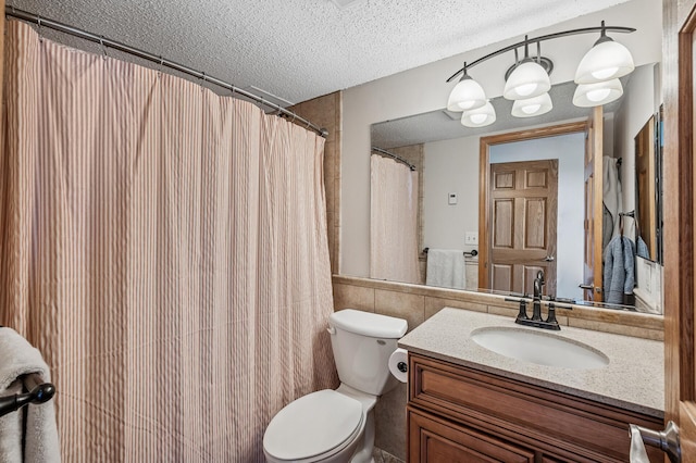 78 10th St E Unit 2901, Saint Paul, MN 55101 - full bathroom with a textured ceiling, tile walls, vanity, and wainscoting