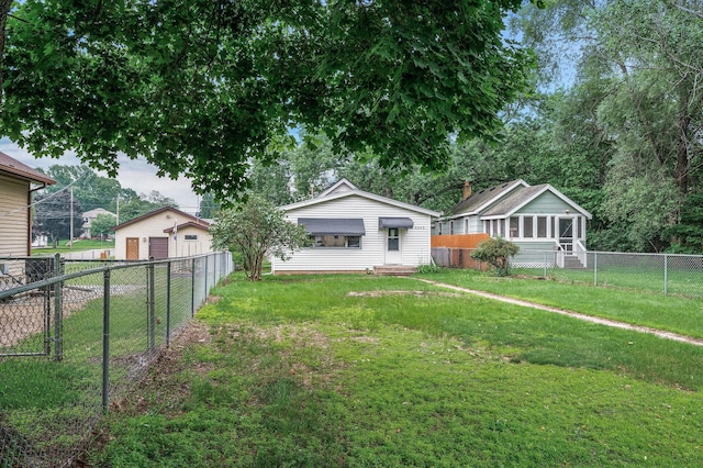 4242 Zane Ave N, Crystal, MN 55422 - fenced backyard with a garage and entry steps