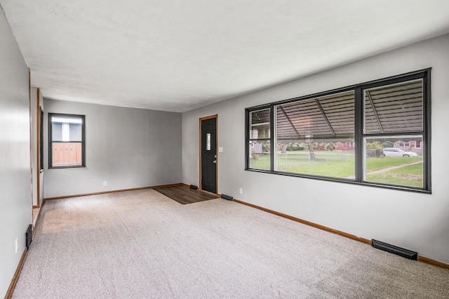 4242 Zane Ave N, Crystal, MN 55422 - unfurnished room featuring carpet flooring and baseboards
