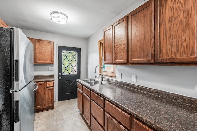 4242 Zane Ave N, Crystal, MN 55422 - kitchen with stainless steel fridge with ice dispenser and brown cabinets