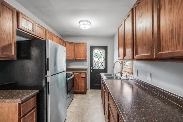 4242 Zane Ave N, Crystal, MN 55422 - kitchen with appliances with stainless steel finishes and brown cabinets