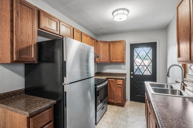 4242 Zane Ave N, Crystal, MN 55422 - kitchen featuring stainless steel appliances, dark countertops, and brown cabinetry