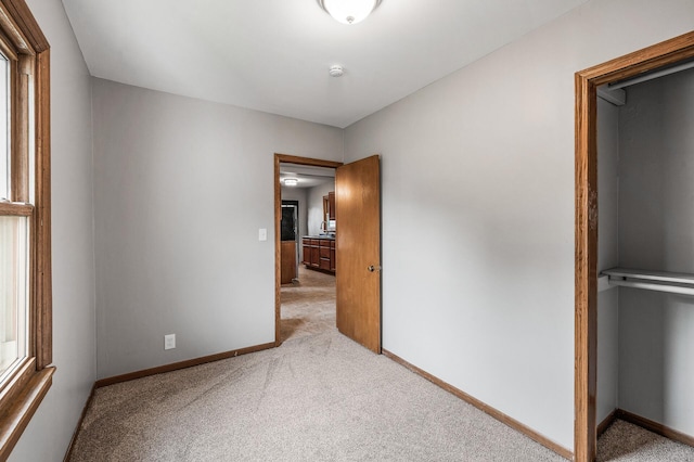 4242 Zane Ave N, Crystal, MN 55422 - unfurnished bedroom featuring carpet and baseboards