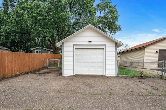 4242 Zane Ave N, Crystal, MN 55422 - detached garage with a gate and asphalt driveway