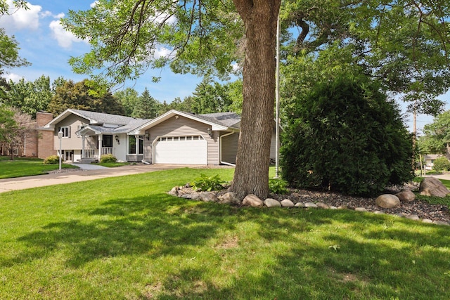 2125 Innsbruck Pkwy, Columbia Heights, MN 55421 - view of front of house featuring a garage, a front lawn, and driveway
