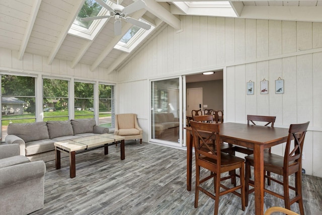 2125 Innsbruck Pkwy, Columbia Heights, MN 55421 - sunroom with a skylight, a deck, wood finished floors, beamed ceiling, and high vaulted ceiling
