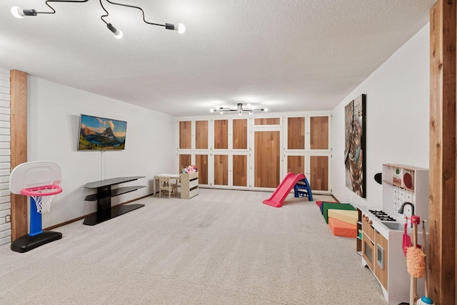 2125 Innsbruck Pkwy, Columbia Heights, MN 55421 - recreation room featuring a textured ceiling and carpet