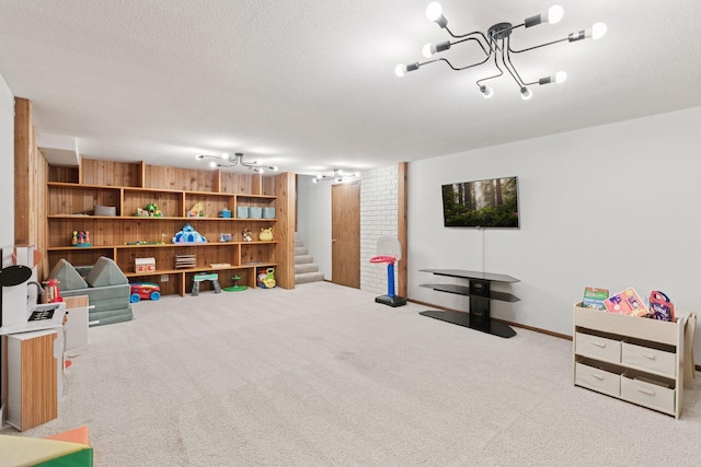 2125 Innsbruck Pkwy, Columbia Heights, MN 55421 - recreation room featuring carpet floors, a chandelier, and a textured ceiling
