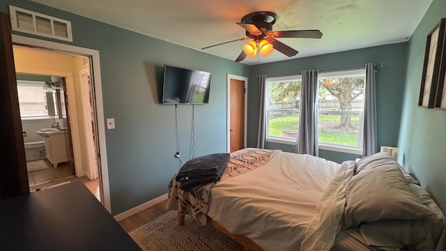 804 17th St SW, Austin, MN 55912 - bedroom featuring multiple windows and a ceiling fan
