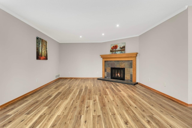8824 134th St W, Apple Valley, MN 55124 - unfurnished living room with light wood finished floors, crown molding, recessed lighting, and a fireplace