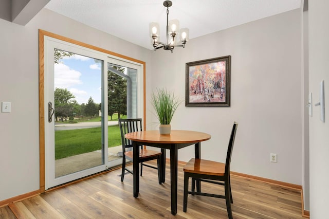 8824 134th St W, Apple Valley, MN 55124 - dining space with a chandelier and light wood finished floors