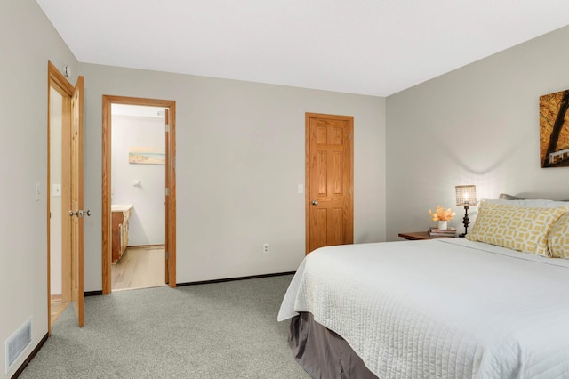 8824 134th St W, Apple Valley, MN 55124 - bedroom with light carpet and ensuite bathroom
