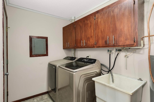 8824 134th St W, Apple Valley, MN 55124 - laundry room featuring electric panel, cabinet space, washing machine and dryer, and a textured ceiling