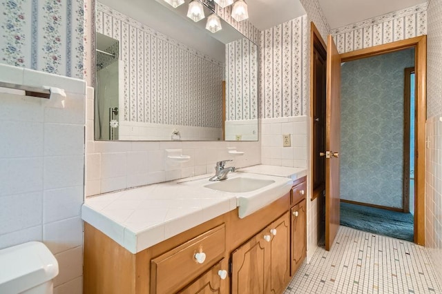 53 Morningside Dr, Saint Paul, MN 55119 - full bathroom with tile walls, vanity, wallpapered walls, wainscoting, and tile patterned floors