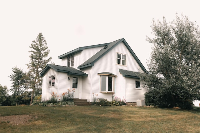 2834 150th St, Luck, WI 54837 - view of property exterior featuring a lawn and roof with shingles