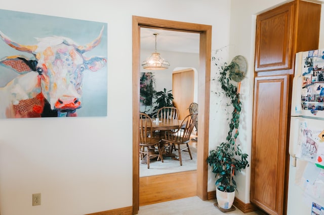 2834 150th St, Luck, WI 54837 - hall with arched walkways and light wood-style floors