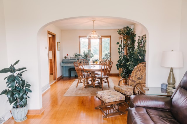2834 150th St, Luck, WI 54837 - dining area with arched walkways and light wood-style flooring