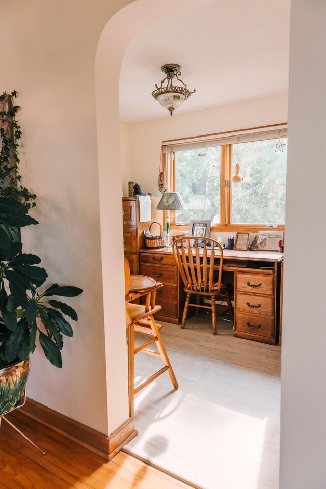 2834 150th St, Luck, WI 54837 - home office featuring light wood finished floors and arched walkways