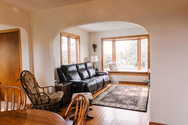 2834 150th St, Luck, WI 54837 - living area featuring arched walkways and wood finished floors