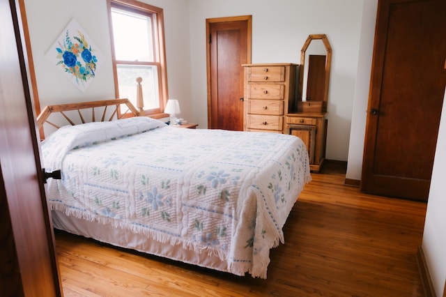 2834 150th St, Luck, WI 54837 - bedroom featuring wood finished floors and baseboards
