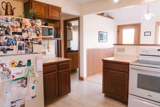 2834 150th St, Luck, WI 54837 - kitchen with white appliances, light wood finished floors, and light countertops