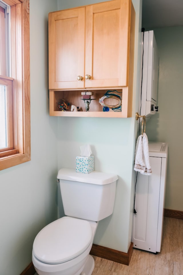 2834 150th St, Luck, WI 54837 - half bathroom featuring baseboards and wood finished floors