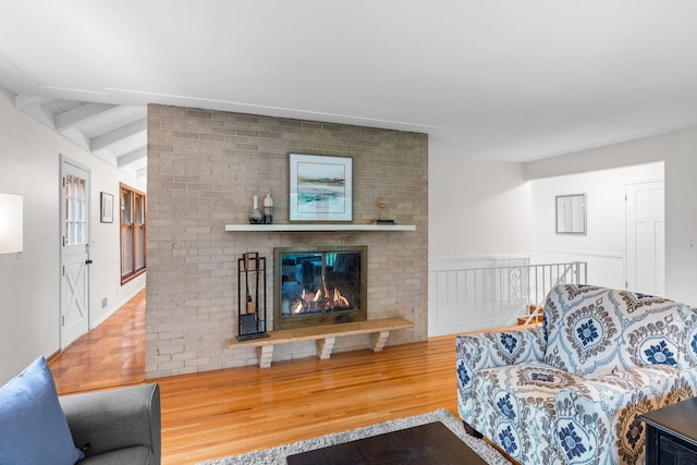 715 Forest Dale Rd, New Brighton, MN 55112 - living room with wood finished floors and a brick fireplace