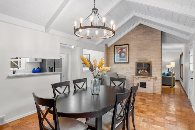 715 Forest Dale Rd, New Brighton, MN 55112 - dining area with a chandelier and a fireplace