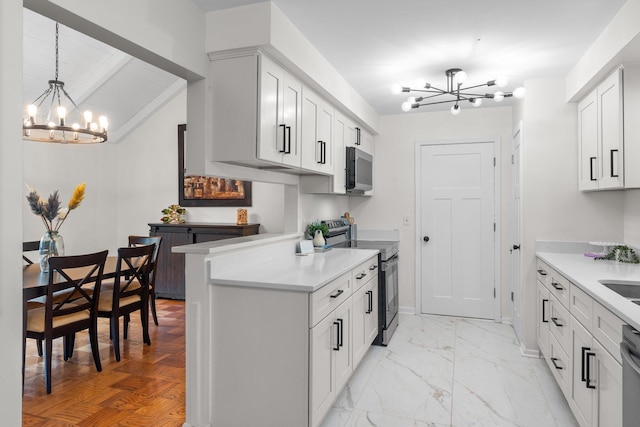 715 Forest Dale Rd, New Brighton, MN 55112 - kitchen with a chandelier, appliances with stainless steel finishes, light countertops, and white cabinets