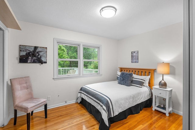 715 Forest Dale Rd, New Brighton, MN 55112 - bedroom featuring light wood-style floors and baseboards