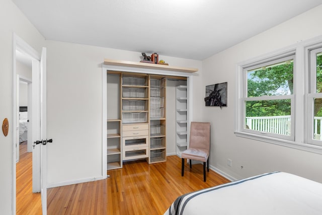 715 Forest Dale Rd, New Brighton, MN 55112 - bedroom featuring wood finished floors and a closet
