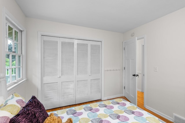 715 Forest Dale Rd, New Brighton, MN 55112 - bedroom featuring light wood-style floors and a closet