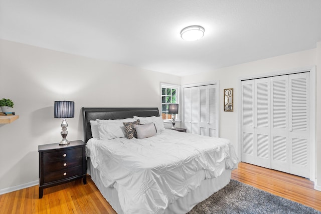 715 Forest Dale Rd, New Brighton, MN 55112 - bedroom featuring two closets and light wood-type flooring