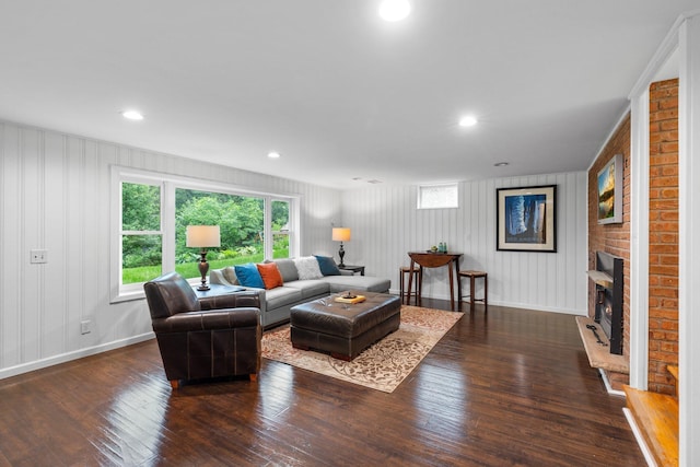 715 Forest Dale Rd, New Brighton, MN 55112 - living room featuring dark wood-type flooring, a brick fireplace, and recessed lighting