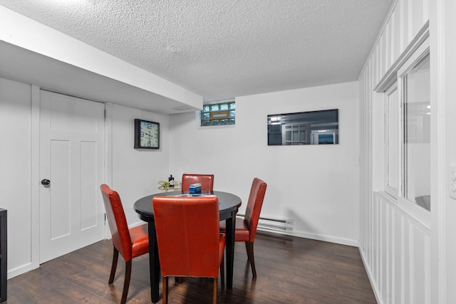 715 Forest Dale Rd, New Brighton, MN 55112 - dining room featuring dark wood-style flooring, a textured ceiling, and a baseboard radiator