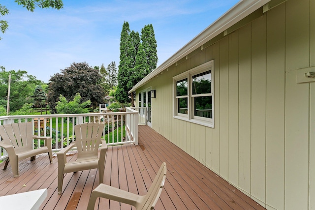 715 Forest Dale Rd, New Brighton, MN 55112 - wooden deck featuring view of wooded area