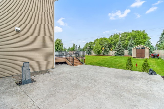369 144th Ln NW, Andover, MN 55304 - fenced backyard featuring a patio area, a storage unit, and a deck