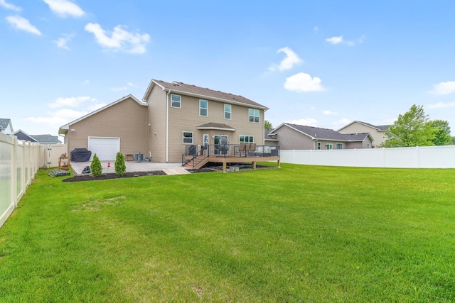 369 144th Ln NW, Andover, MN 55304 - rear view of house with a deck, a fenced backyard, and a patio