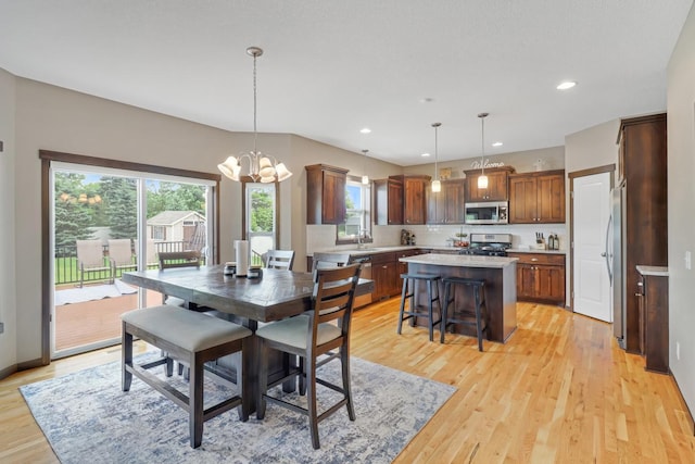369 144th Ln NW, Andover, MN 55304 - dining area with light wood-style floors, recessed lighting, and a chandelier