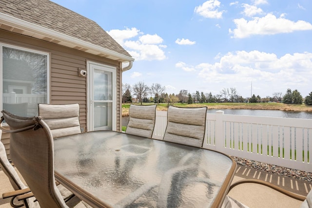 1978 110th Ct NE Unit 1103, Blaine, MN 55449 - deck featuring outdoor dining space and a water view