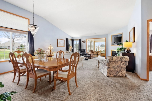 1978 110th Ct NE Unit 1103, Blaine, MN 55449 - carpeted dining area featuring lofted ceiling, healthy amount of natural light, and a chandelier