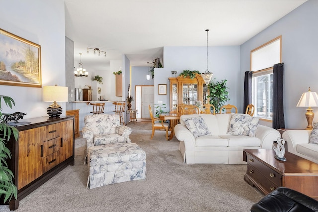 1978 110th Ct NE Unit 1103, Blaine, MN 55449 - living room featuring light carpet and a chandelier