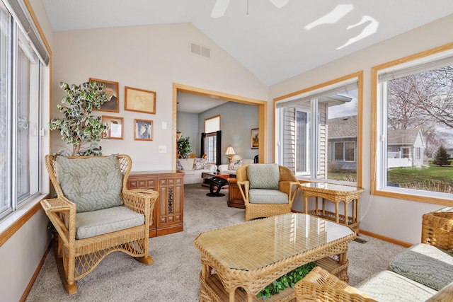 1978 110th Ct NE Unit 1103, Blaine, MN 55449 - living room featuring plenty of natural light, light carpet, vaulted ceiling, and a ceiling fan