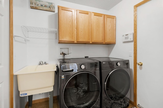 1978 110th Ct NE Unit 1103, Blaine, MN 55449 - laundry room featuring cabinet space and washer and clothes dryer