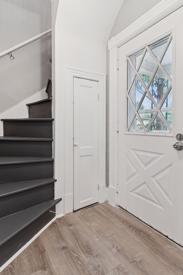 59 Winnipeg Ave, Saint Paul, MN 55117 - staircase featuring wood finished floors and vaulted ceiling