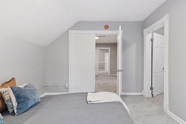 59 Winnipeg Ave, Saint Paul, MN 55117 - unfurnished bedroom featuring light carpet and vaulted ceiling