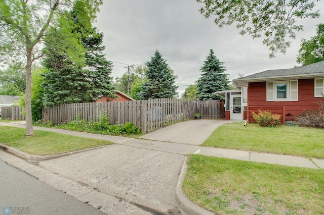 1021 1st St S, Moorhead, MN 56560 - fenced front yard with concrete driveway