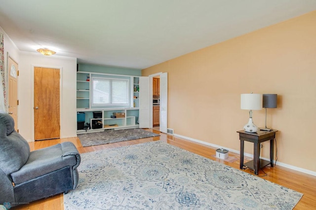 1021 1st St S, Moorhead, MN 56560 - living area with wood finished floors and baseboards